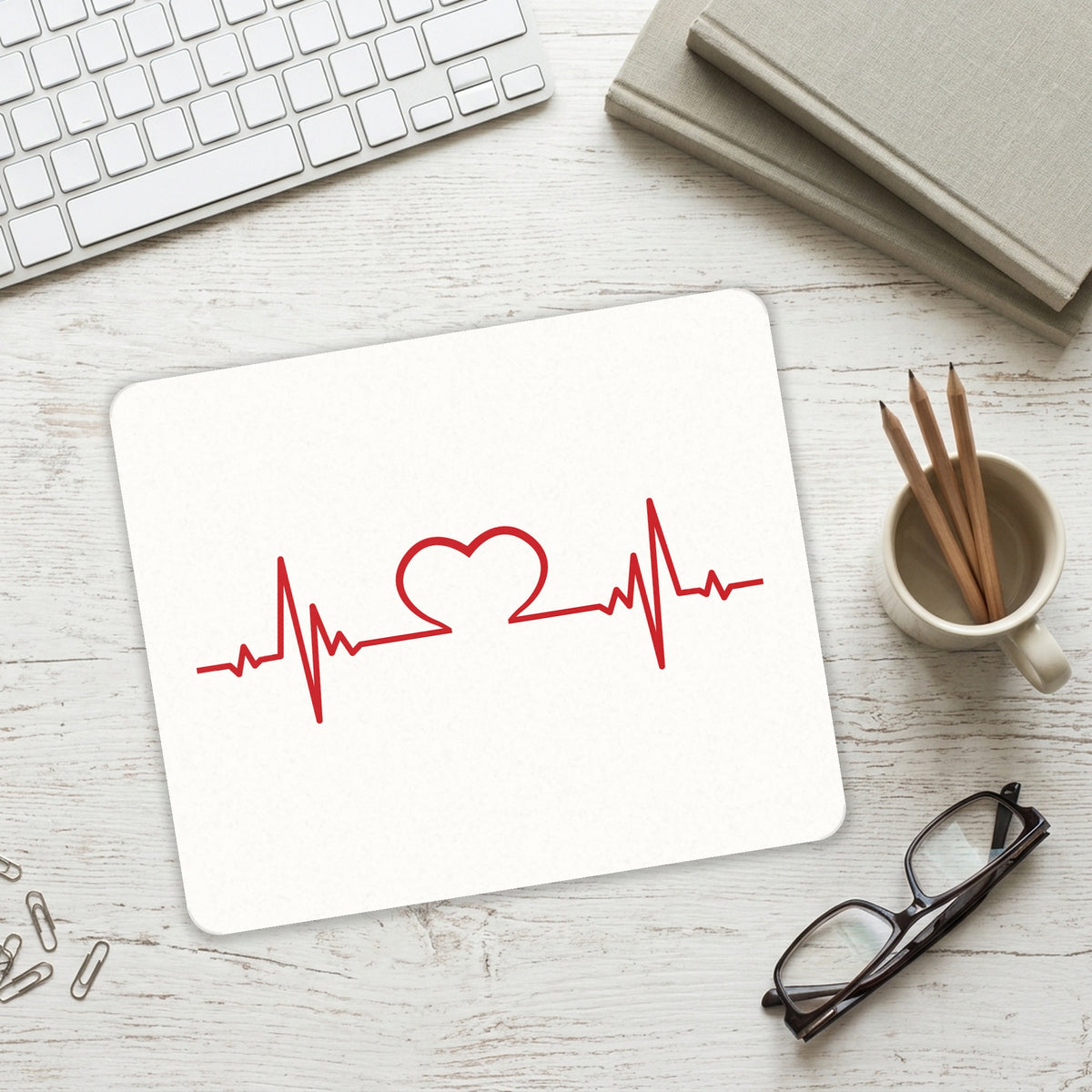 Heart Pulse EKG Red Valentine mouse pad on a desk with a keyboard