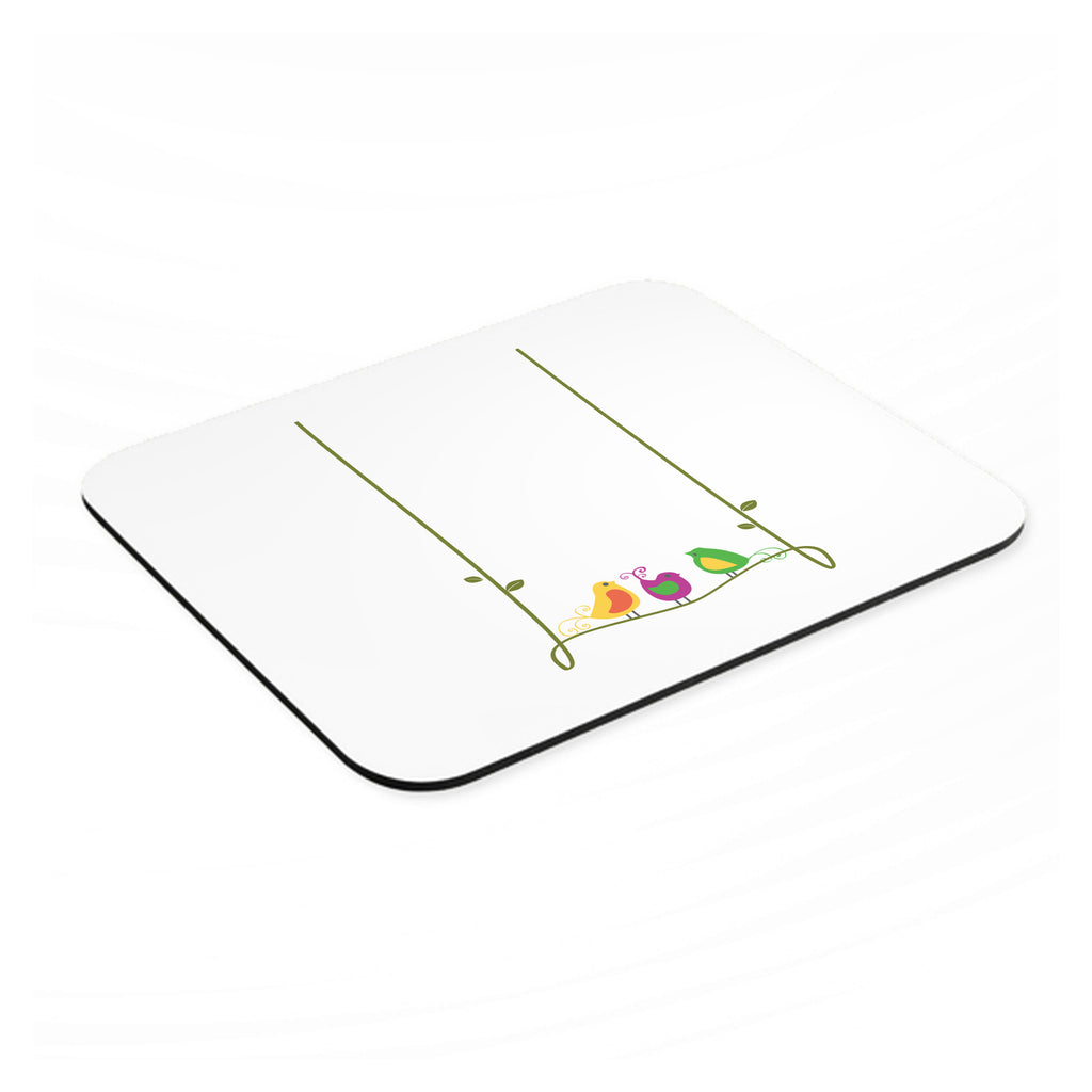 Colorful Birds Cartoon on a Vine mouse pad, angled view showing the 1/4 inch thick base
