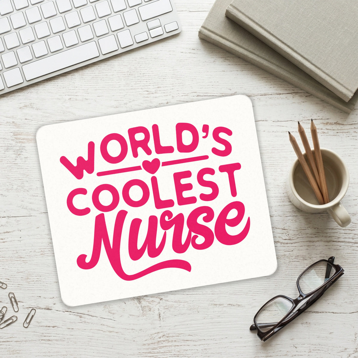 World's Coolest Nurse - Hot Pink mouse pad on a desk with a keyboard
