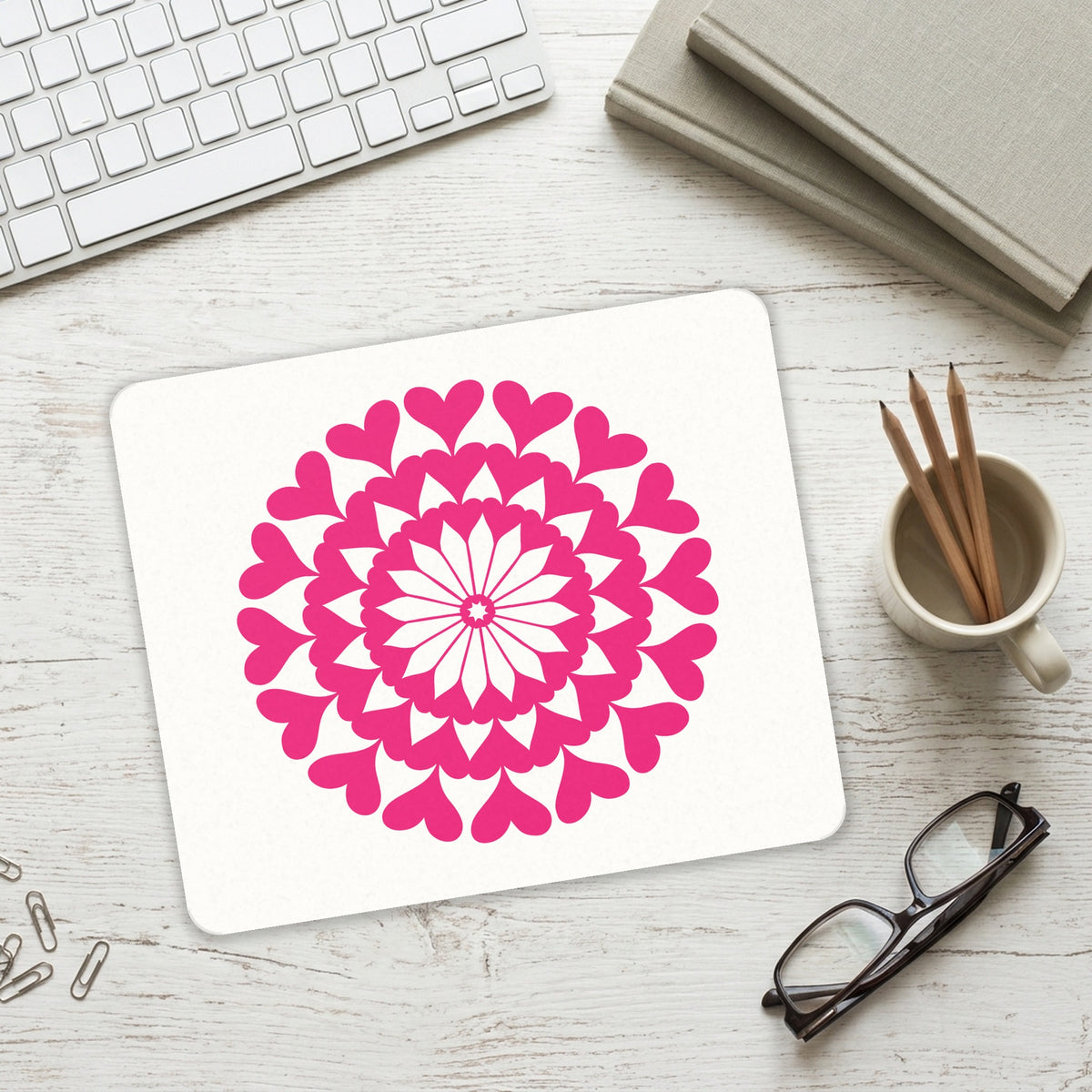 Hot Pink Hearts Mandala mouse pad on a desk with a keyboard