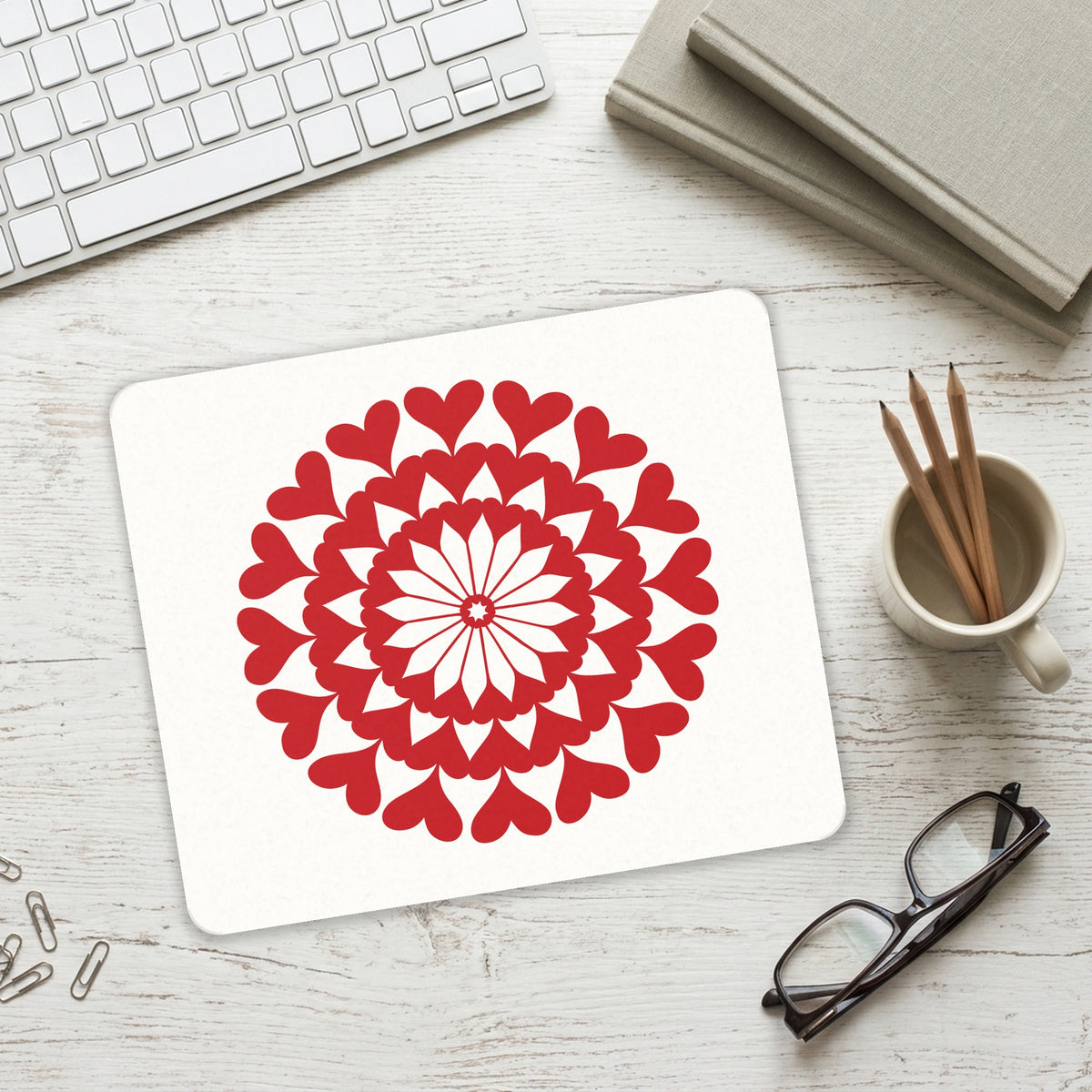 Red Hearts Mandala mouse pad on a desk with a keyboard