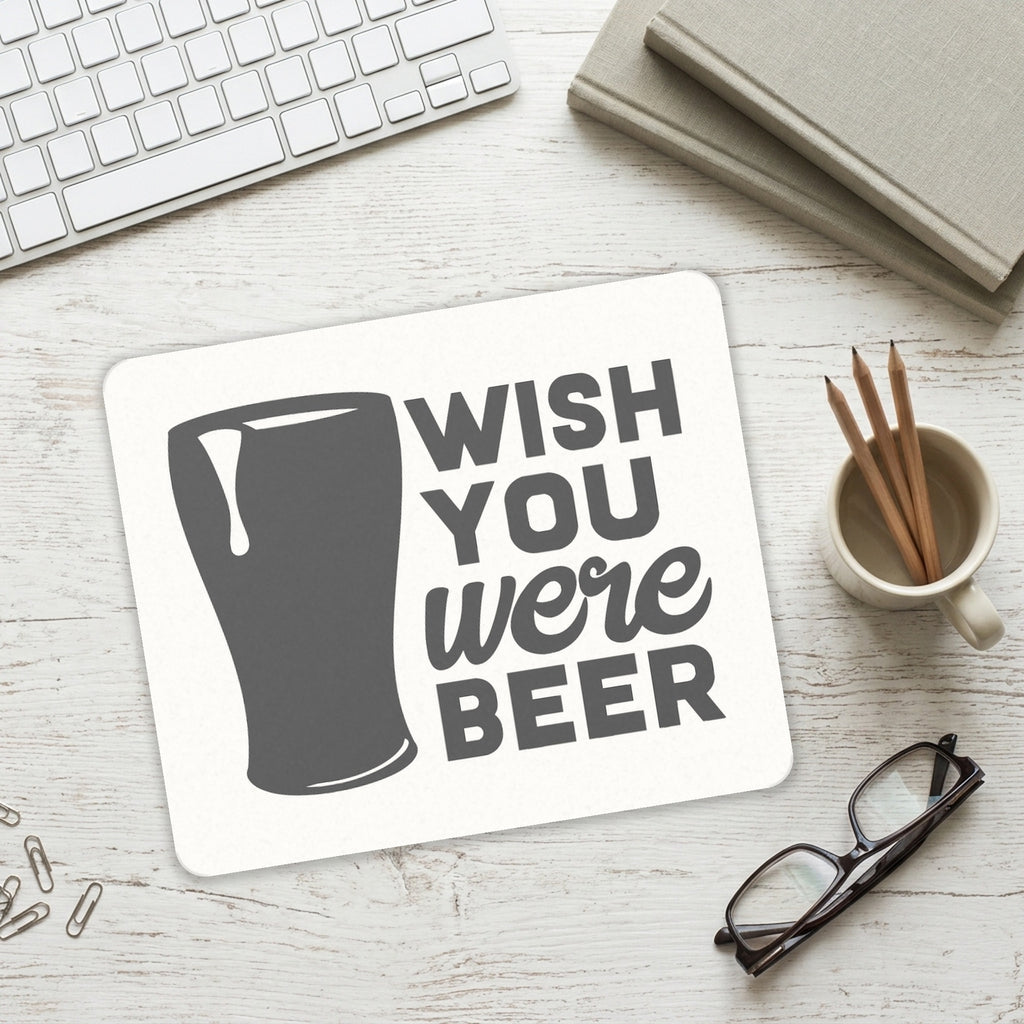 Wish You Were BEER mouse pad on a desk with a keyboard
