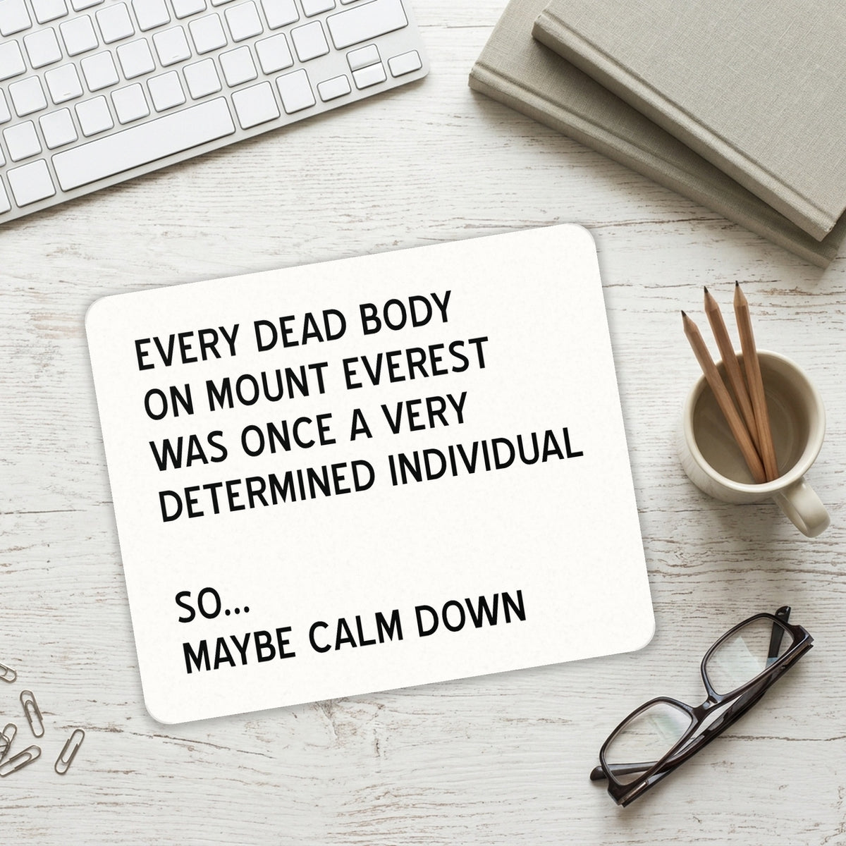 Every Dead Body on Everest - Calm Down mouse pad on a desk with a keyboard