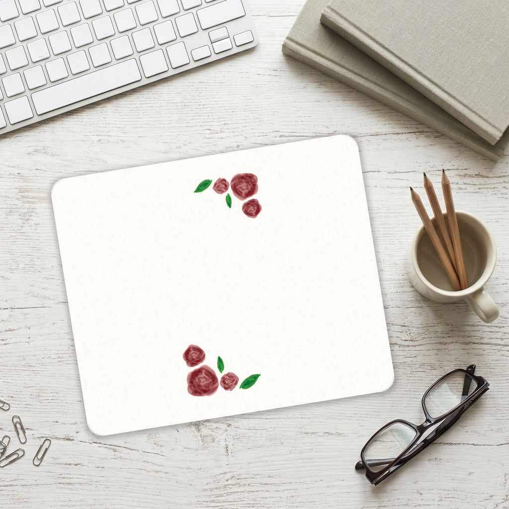 Water colored Roses mouse pad on a desk with a keyboard