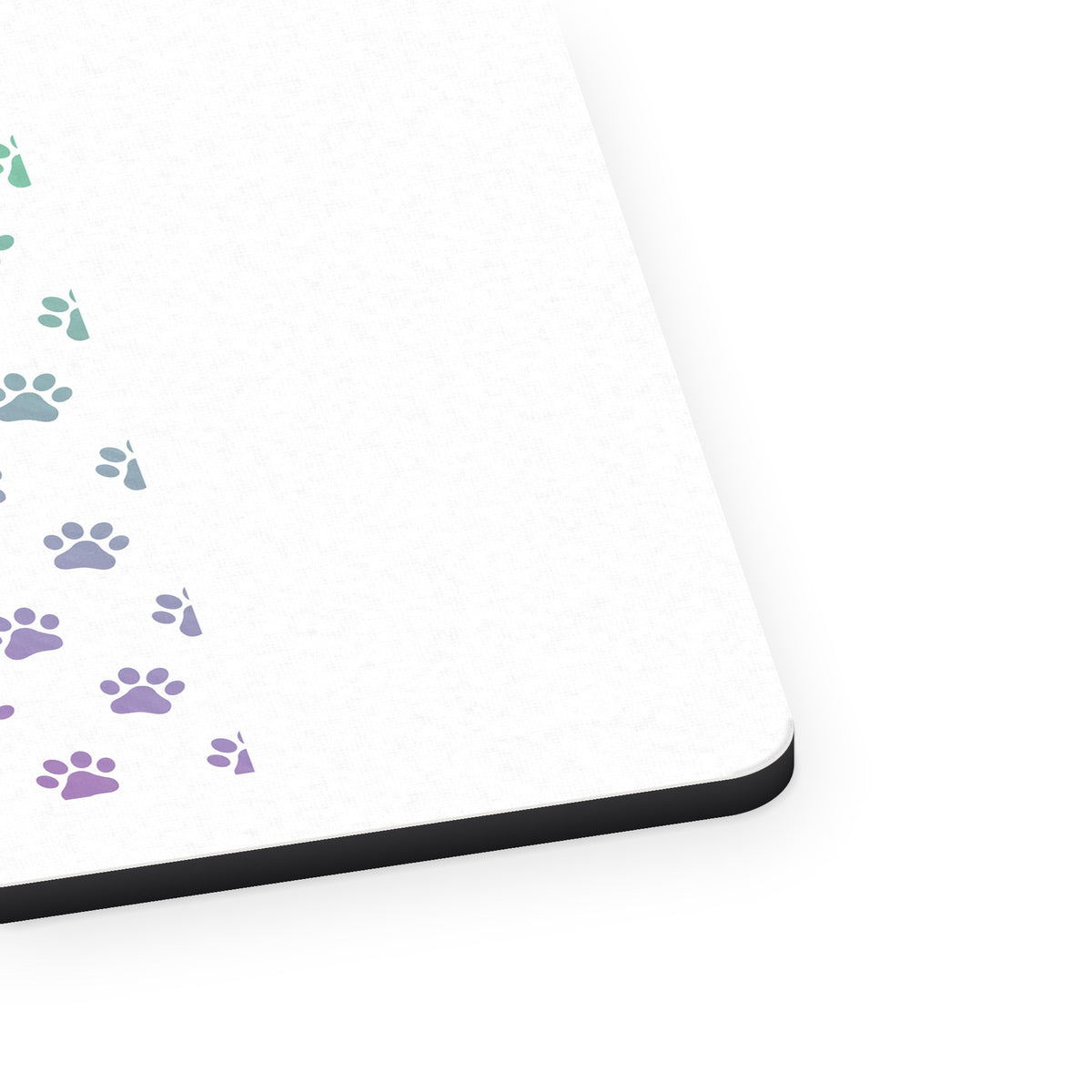 Gradient Pawprints - Purple to Green mouse pad, close-up of the fabric surface and rubber edge