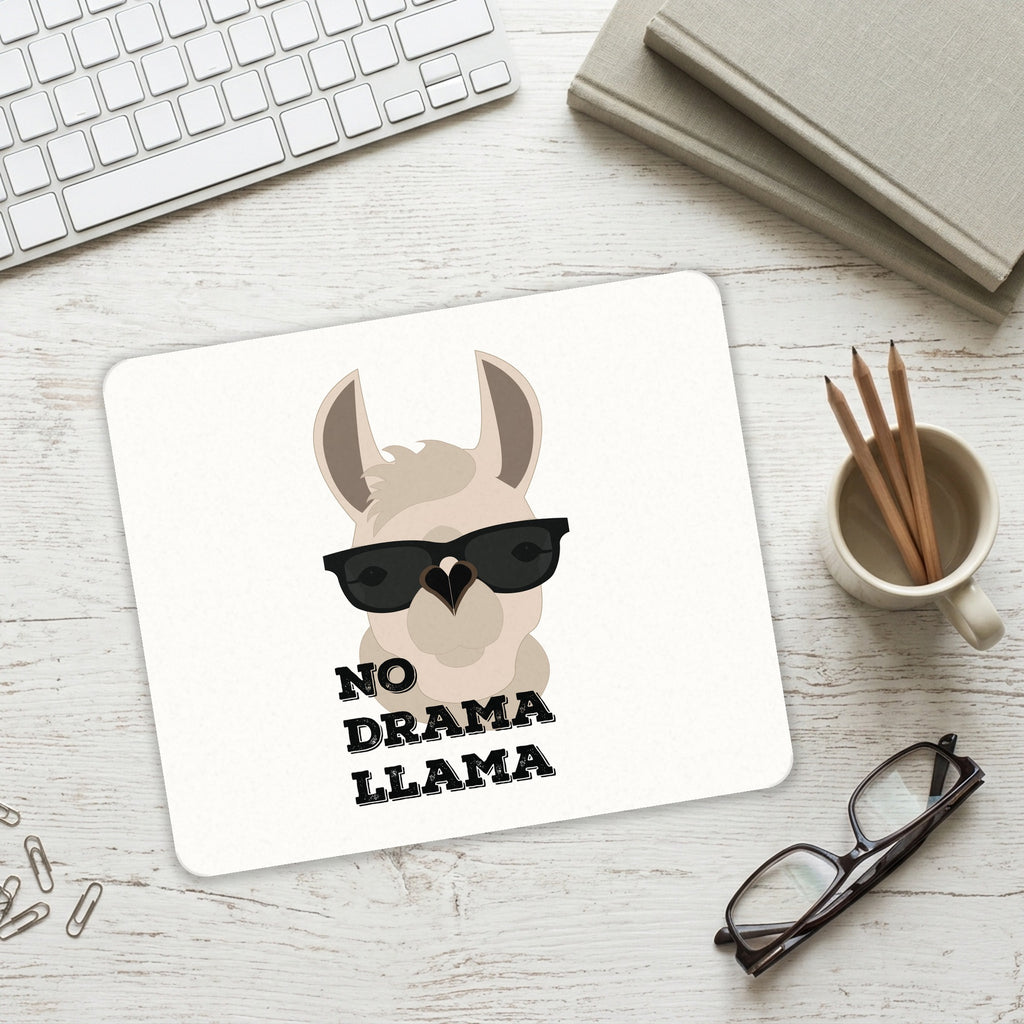 No Drama Llama Cartoon mouse pad on a desk with a keyboard