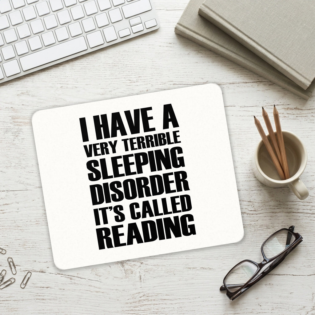 Terrible Sleeping Disorder Called Reading mouse pad on a desk with a keyboard