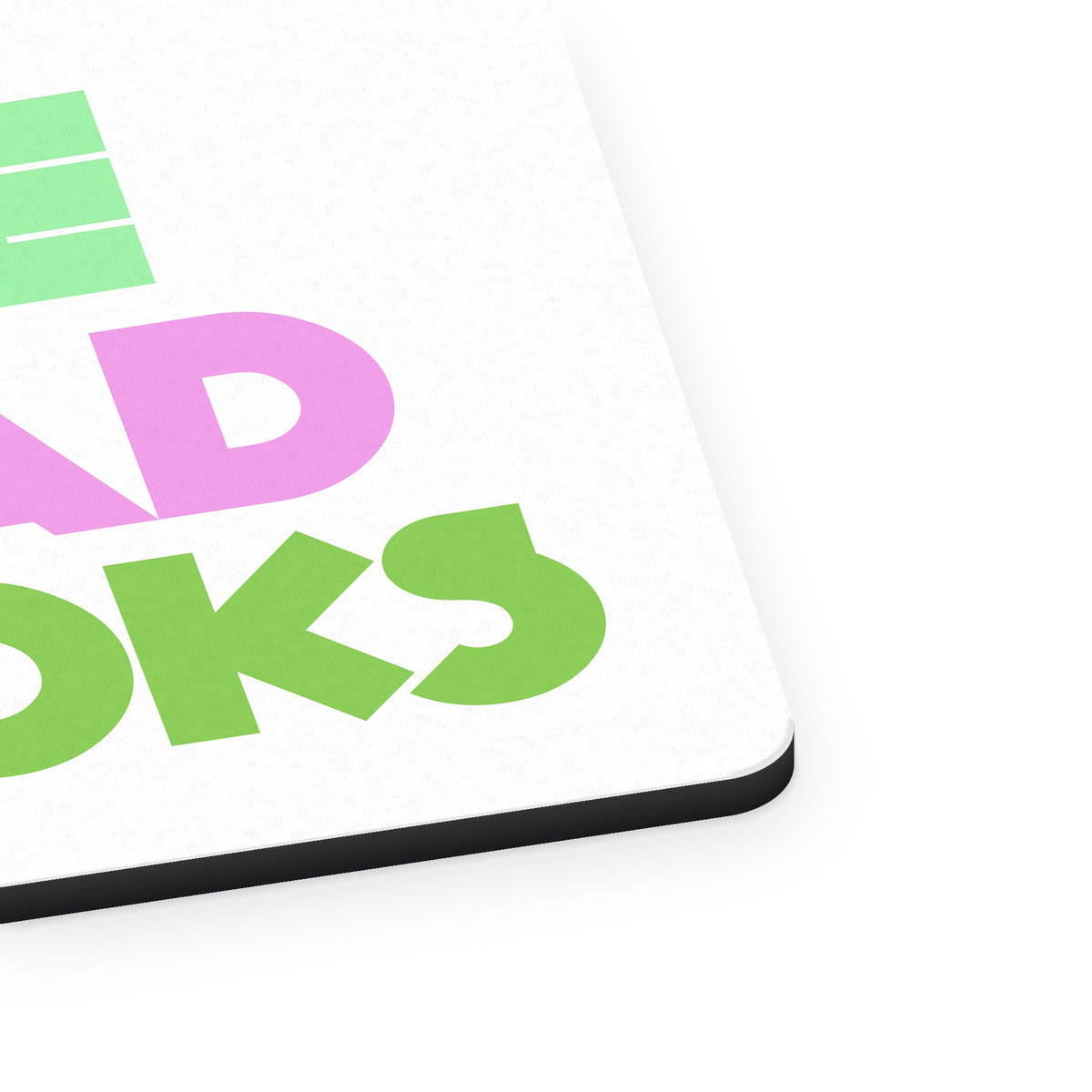 I've Read Books - Pink Green mouse pad, close-up of the fabric surface and rubber edge