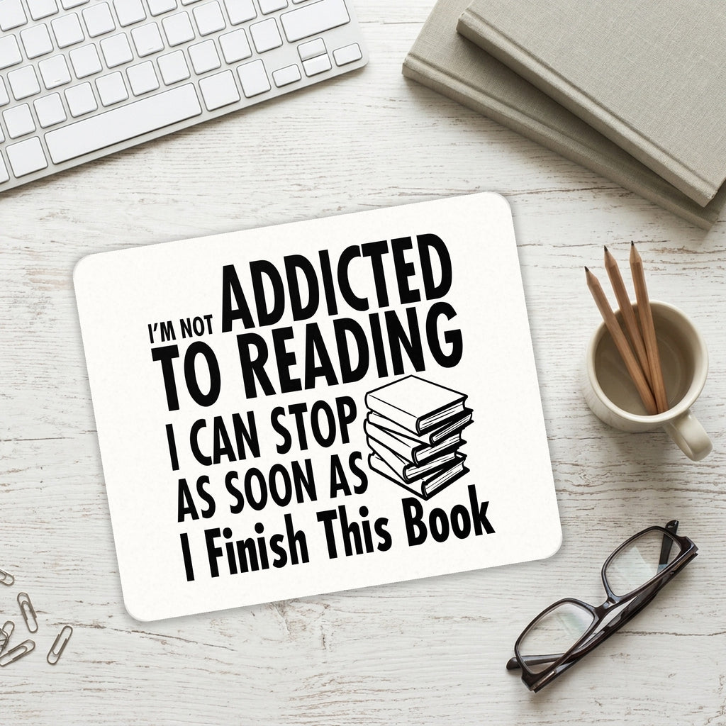 Not Addicted to Reading - Can Stop When I Finish mouse pad on a desk with a keyboard