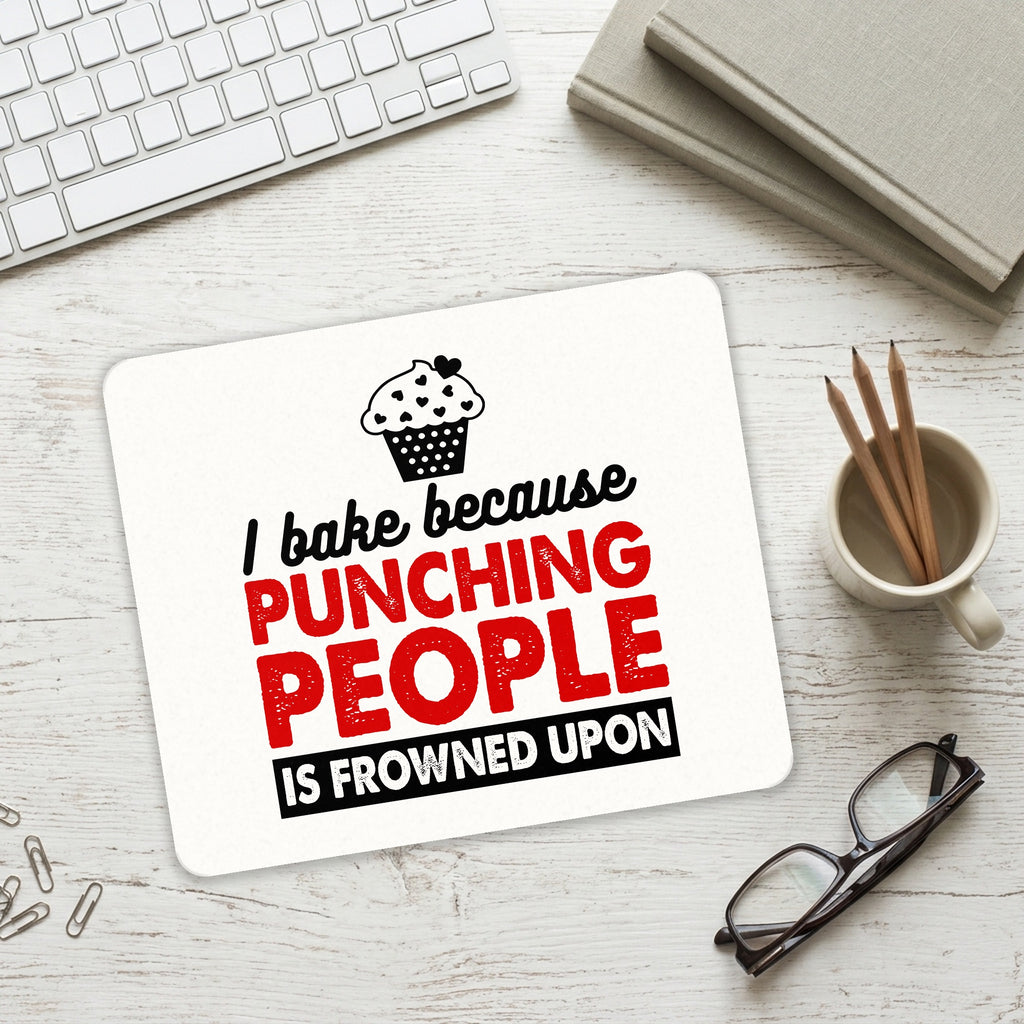 I Bake Because Punching People is Frowned Upon mouse pad on a desk with a keyboard