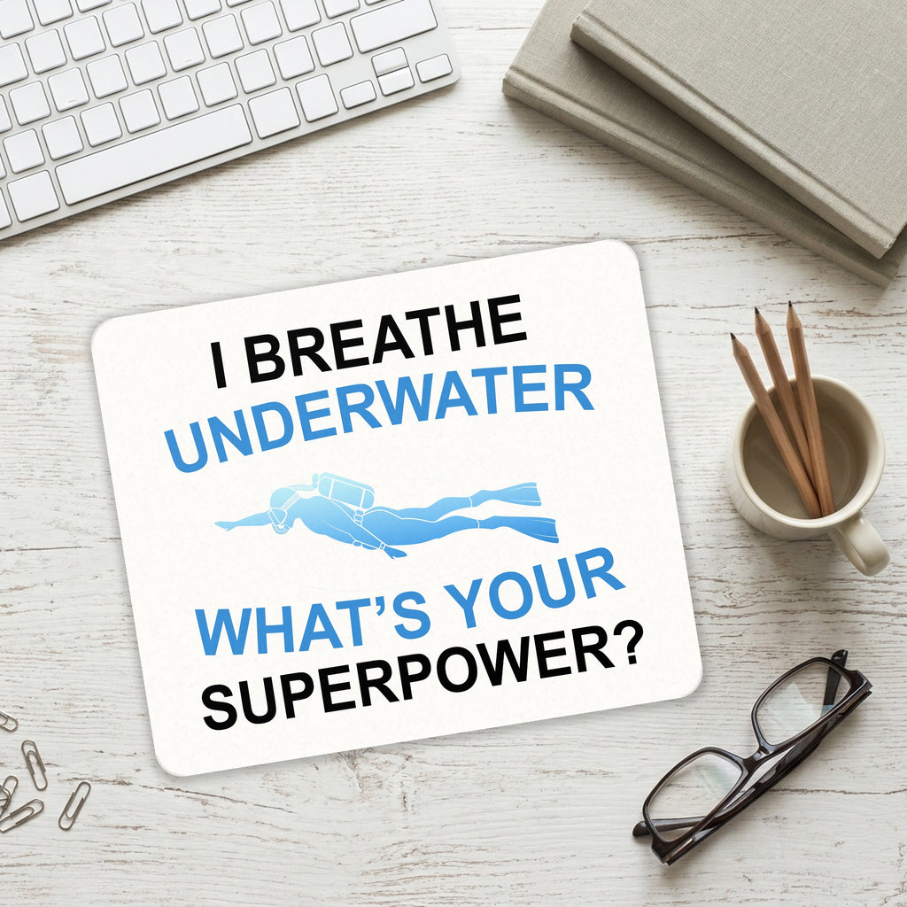 I Breathe Underwater What's Your Superpower mouse pad on a desk with a keyboard