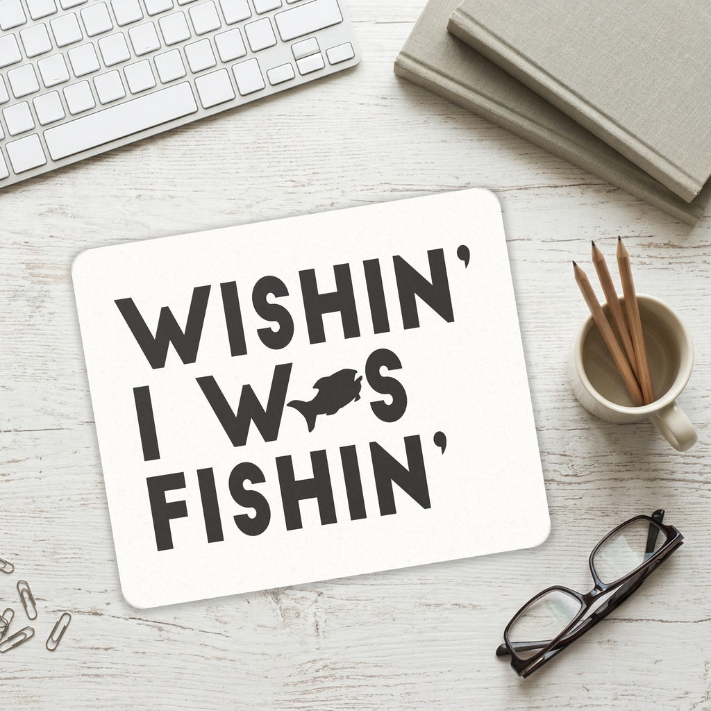 Wishin' I was Fishin' mouse pad on a desk with a keyboard
