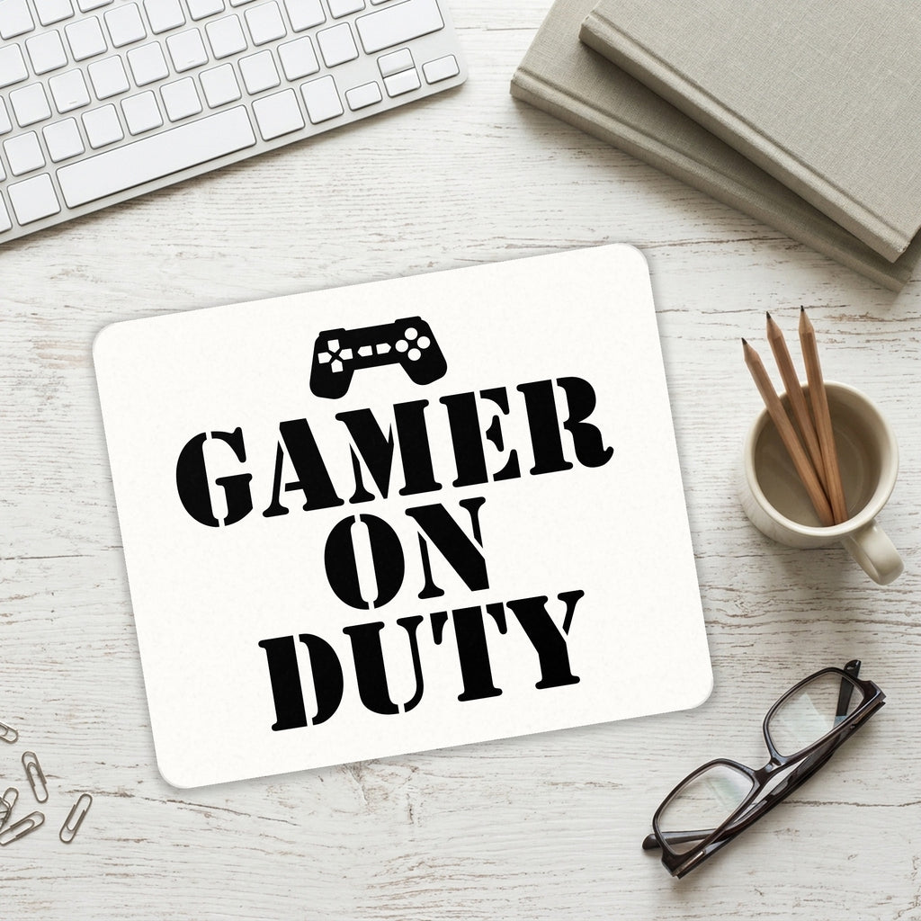 Gamer on Duty Video Games mouse pad on a desk with a keyboard