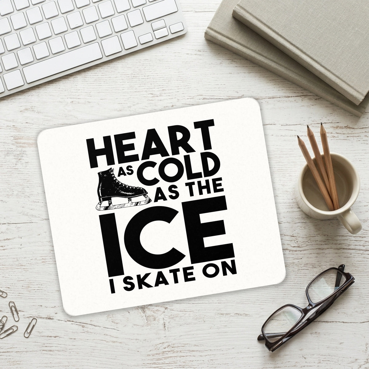 Heart as Cold as the Ice I Skate On mouse pad on a desk with a keyboard