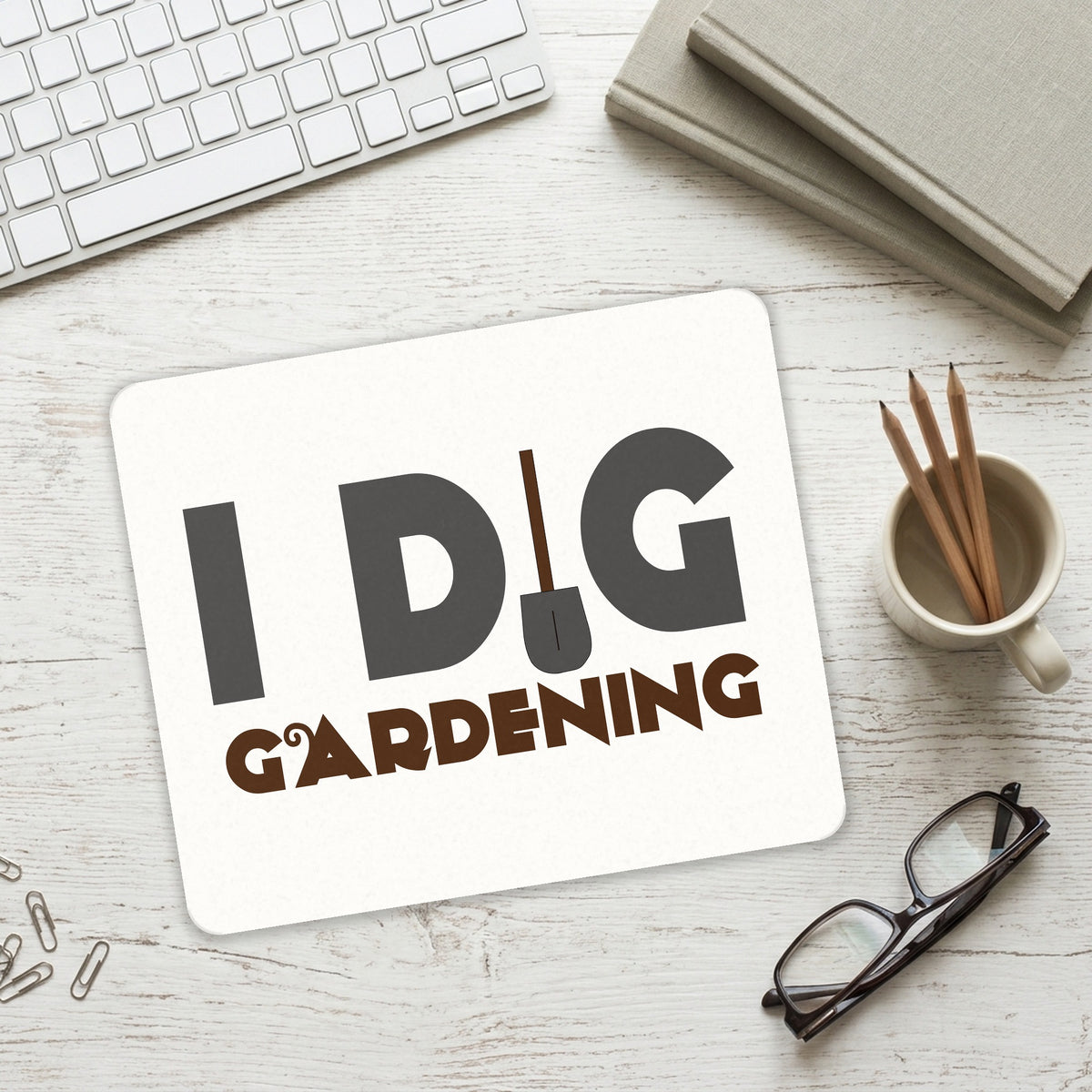 I Dig Gardening mouse pad on a desk with a keyboard