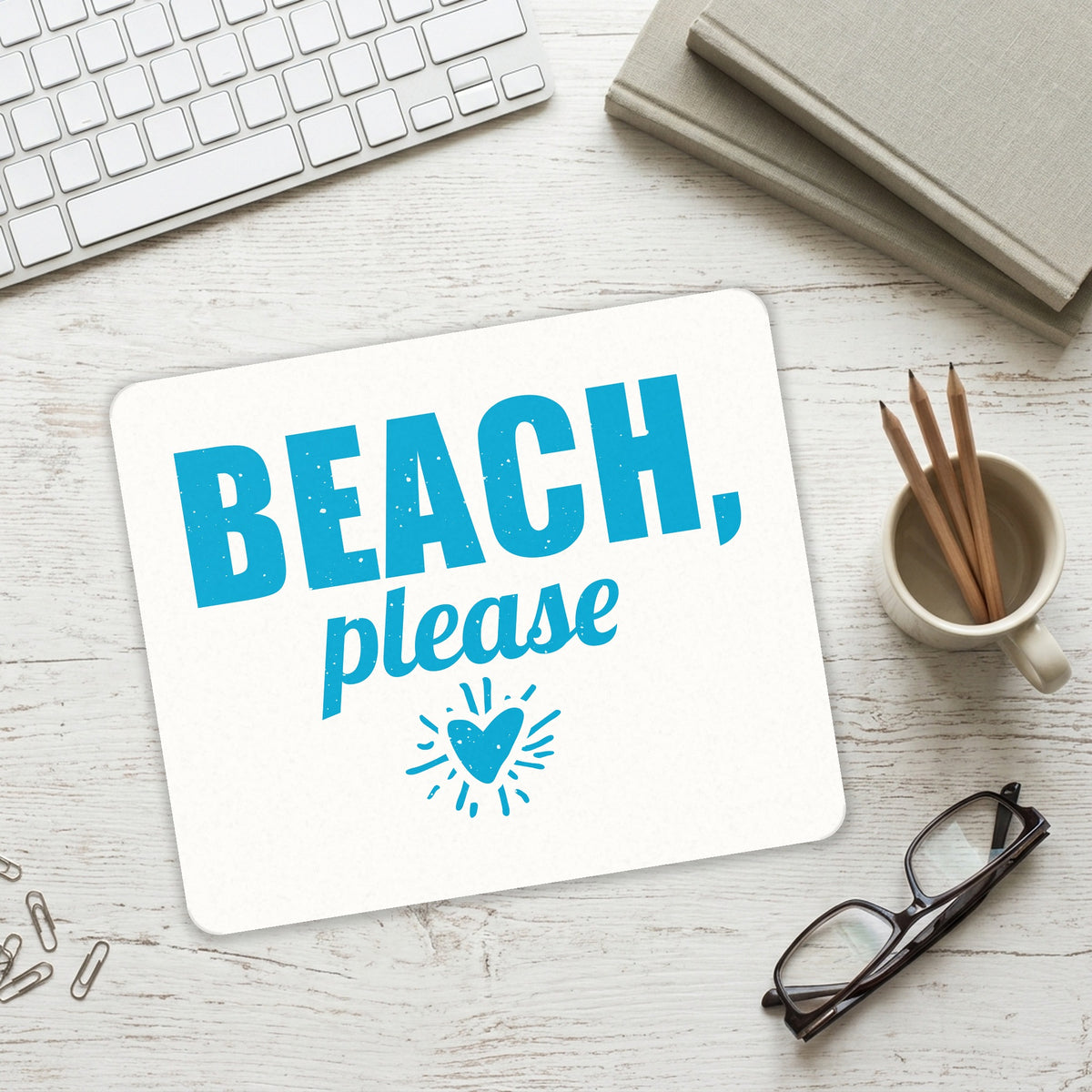 Beach, Please mouse pad on a desk with a keyboard