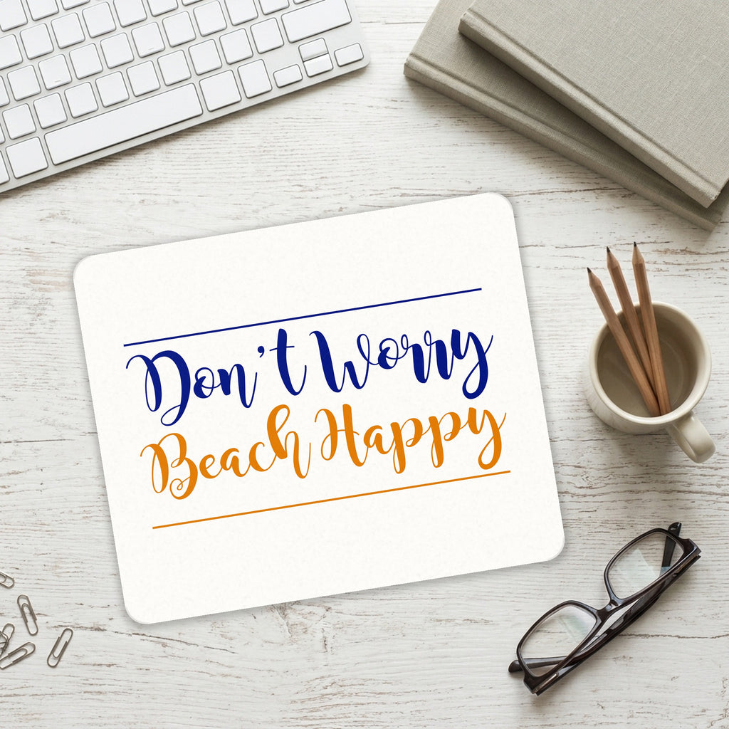 Don't Worry, BEACH Happy mouse pad on a desk with a keyboard