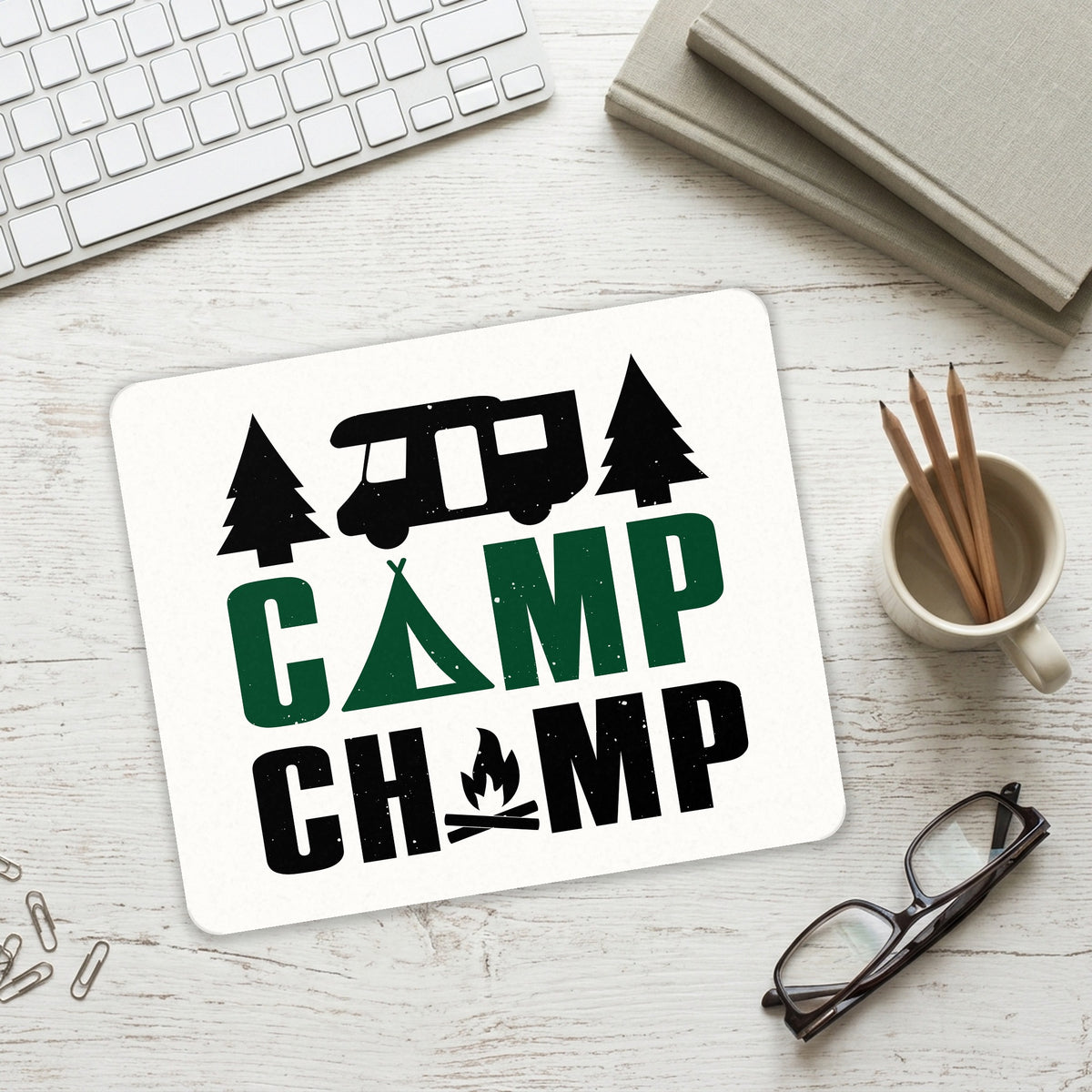 Camp Champ - Camping Fire mouse pad on a desk with a keyboard