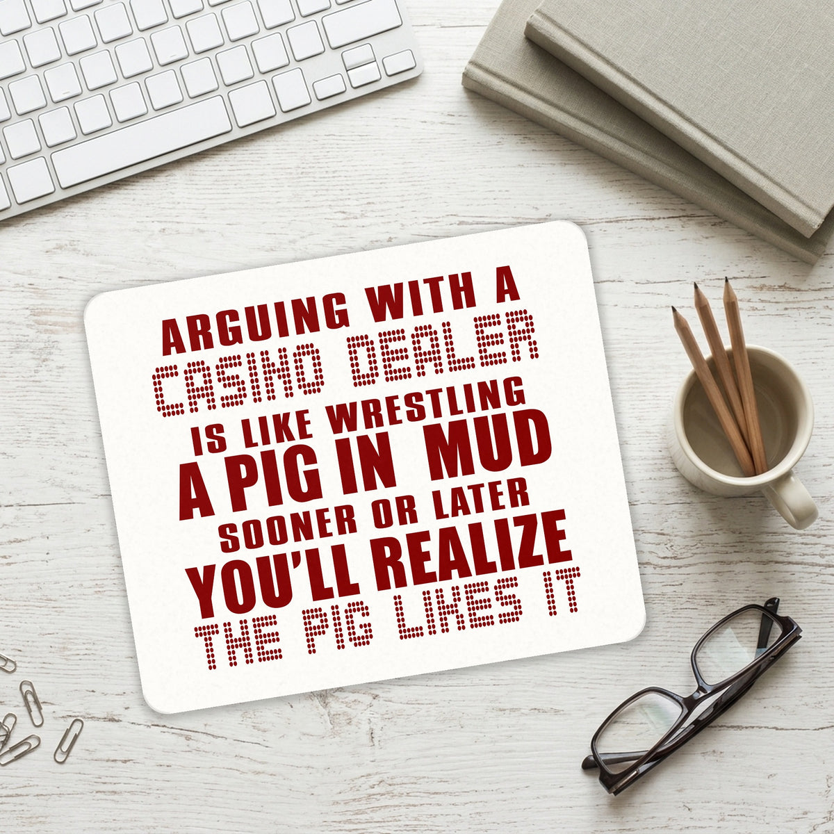 Arguing with Casino Dealer Like Pink in Mud mouse pad on a desk with a keyboard
