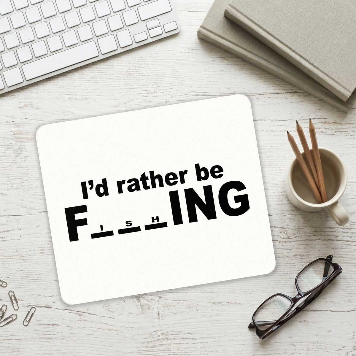 I'd Rather Be Fishing mouse pad on a desk with a keyboard