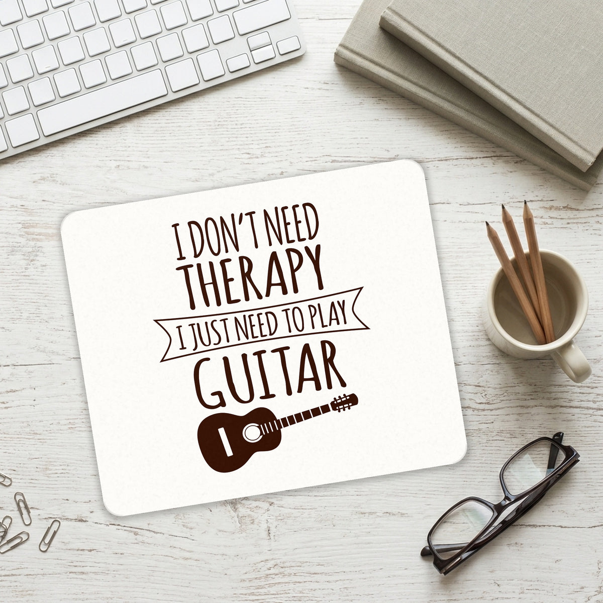 Don't Need Therapy Need to Play Guitar mouse pad on a desk with a keyboard