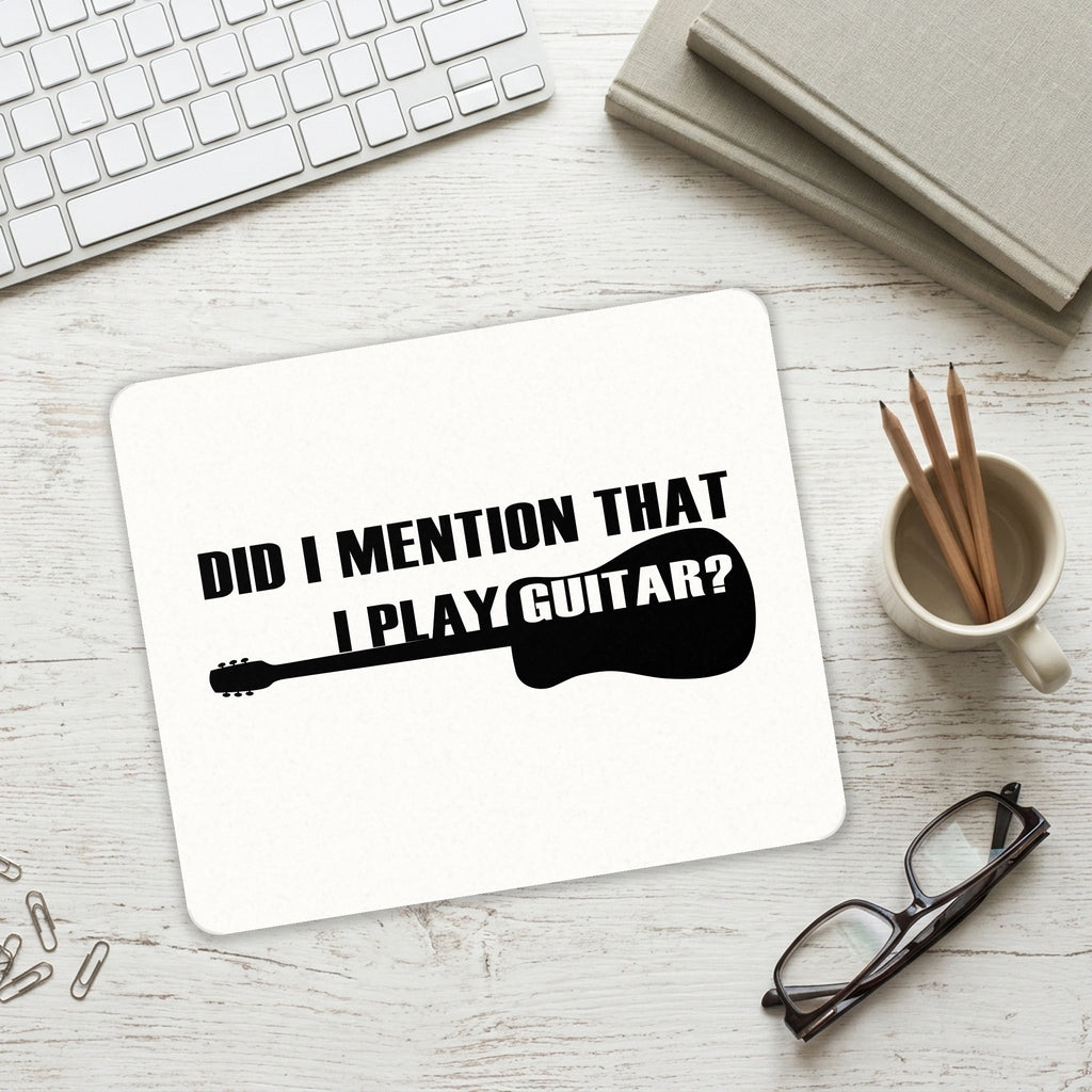 Did I Mention That I Play Guitar? mouse pad on a desk with a keyboard