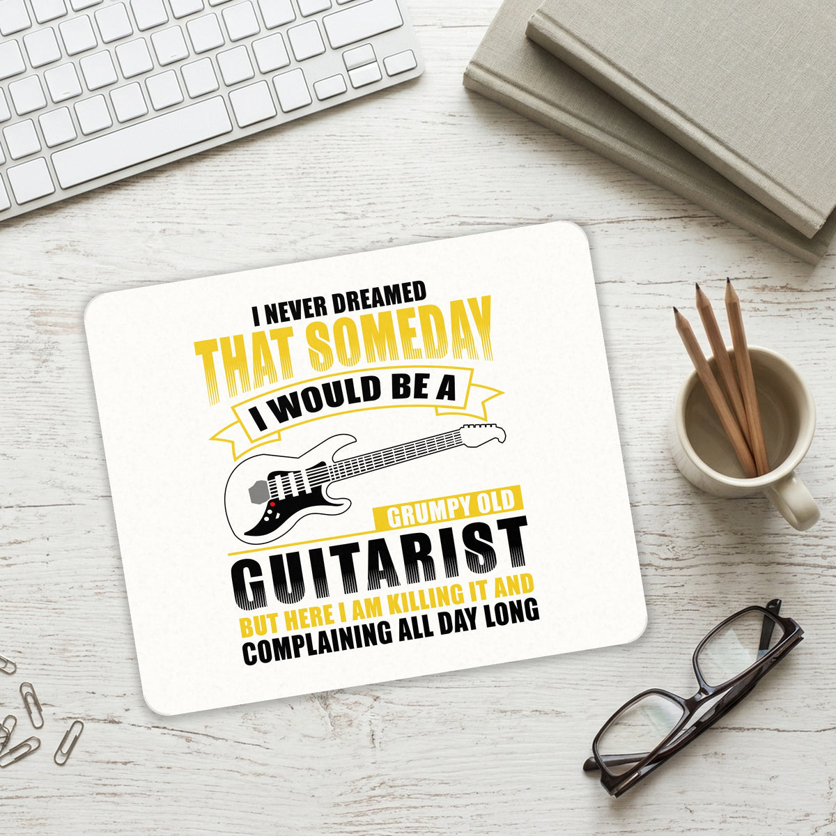 Never Dreamed I'd Be Grumpy Old Guitarist mouse pad on a desk with a keyboard