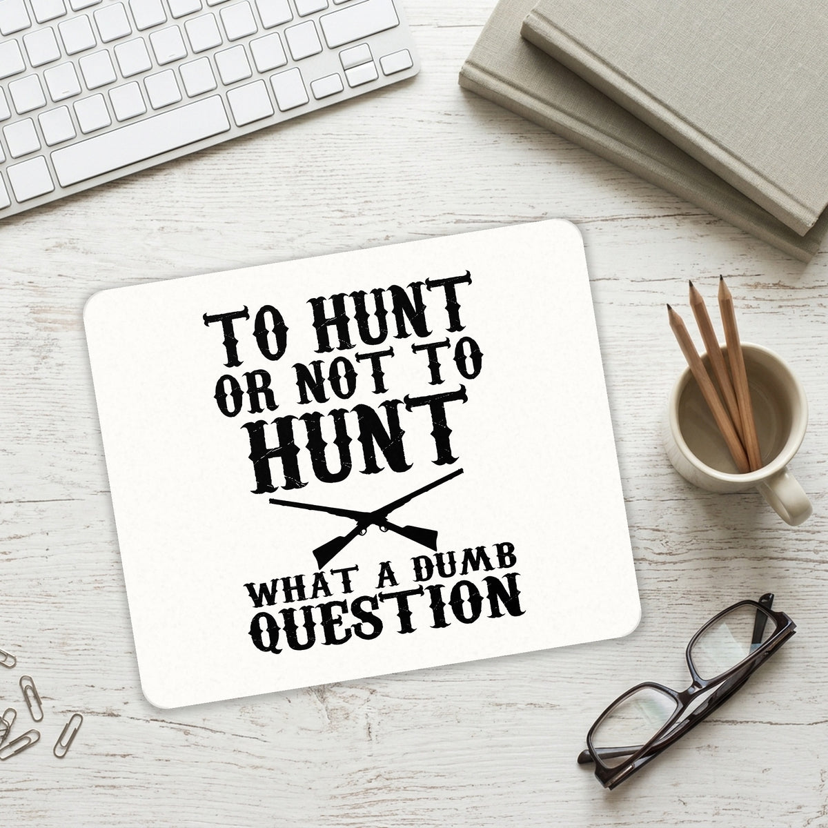 To Hunt or Not - What a Dumb Question mouse pad on a desk with a keyboard