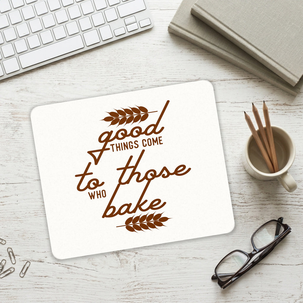 Good Things Come to Those Who Bake mouse pad on a desk with a keyboard