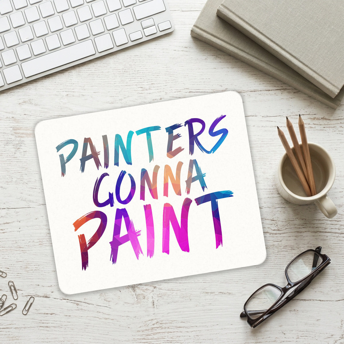 Painters Gonna Paint mouse pad on a desk with a keyboard