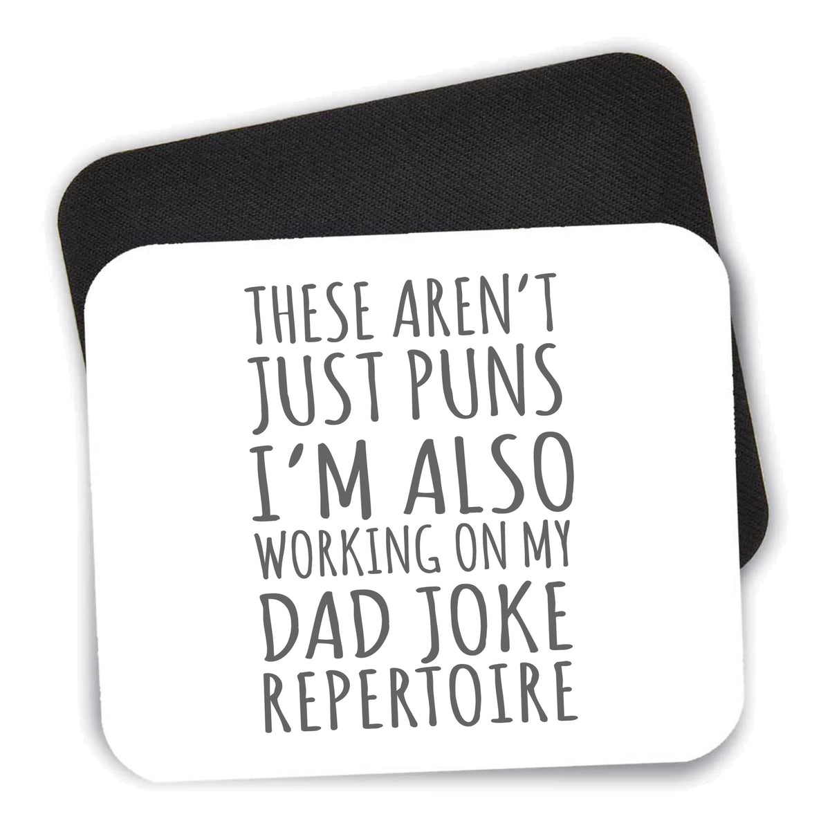 Not Just Puns I'm Also Working Dad Joke mouse pad shown with its black non-slip rubber underside