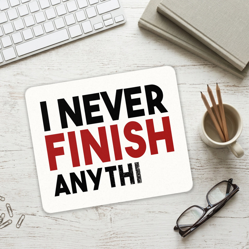 I Never Finish Anythi mouse pad on a desk with a keyboard