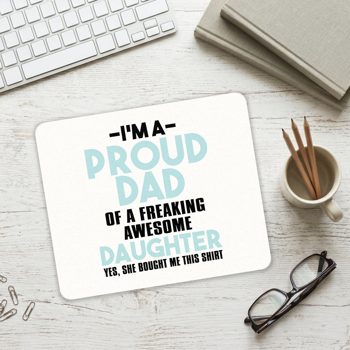 I'm a Proud Dad of Awesome Daughter mouse pad on a desk with a keyboard