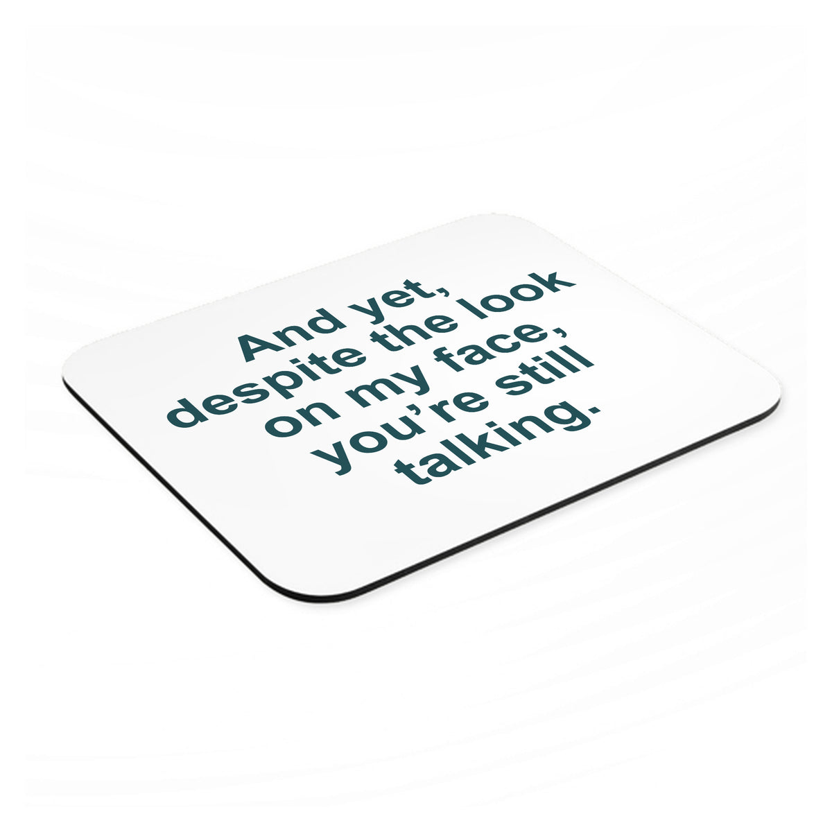 Despite the Look On My Face, Still Talking mouse pad, angled view showing the 1/4 inch thick base