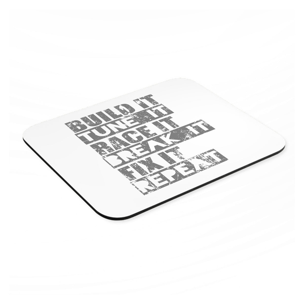 Build It Tune Race Break Fix Repeat mouse pad, angled view showing the 1/4 inch thick base