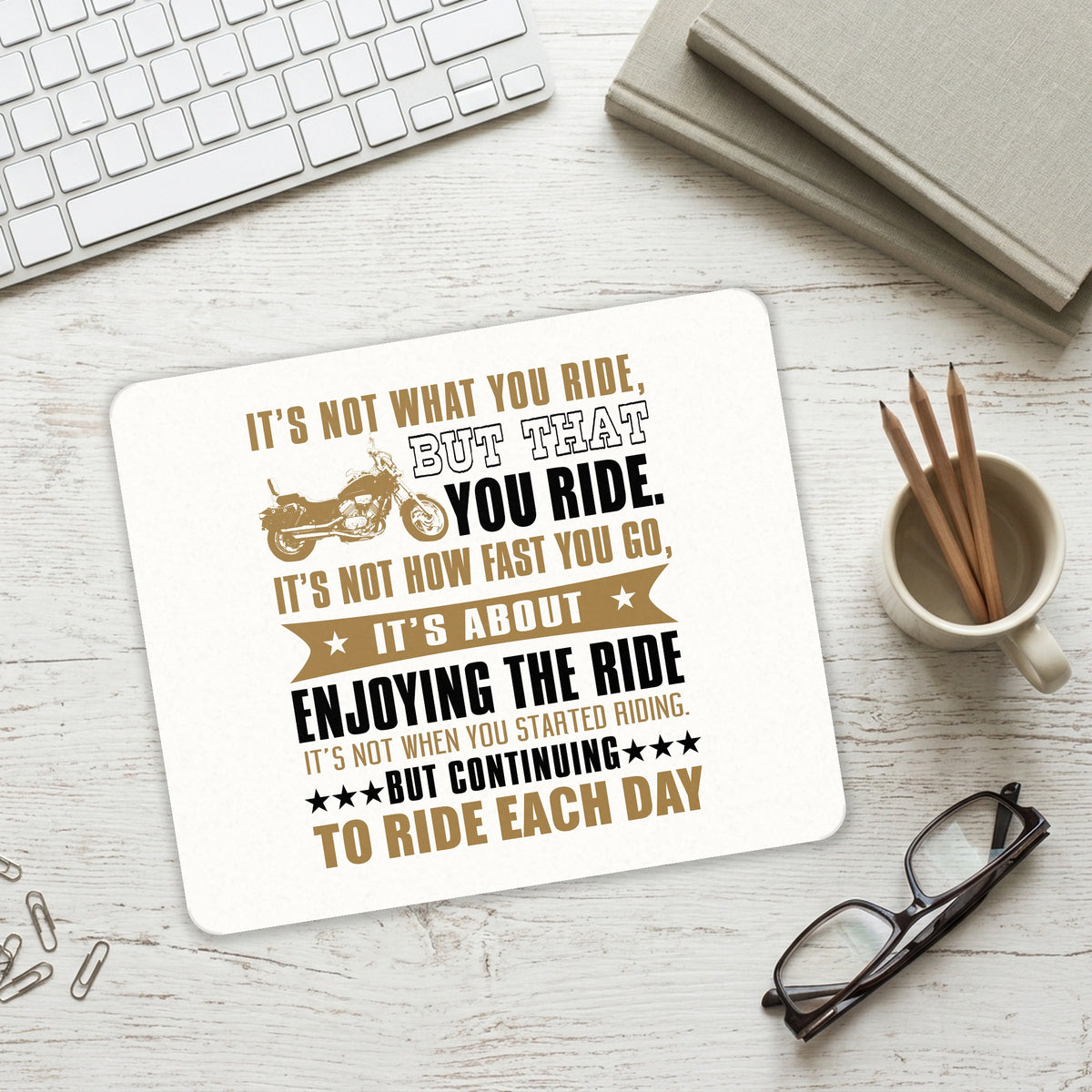 Not What Your Ride, That You Ride Motorcycle mouse pad on a desk with a keyboard