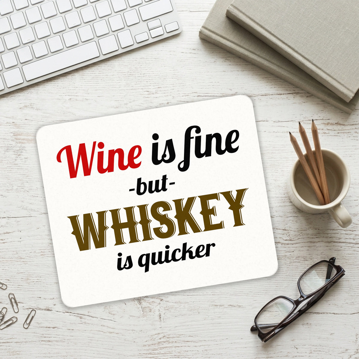 Wine is Fine But Whiskey is Quicker mouse pad on a desk with a keyboard