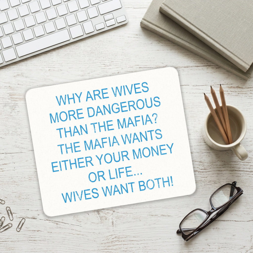Wives More Dangerous Than Mafia? mouse pad on a desk with a keyboard