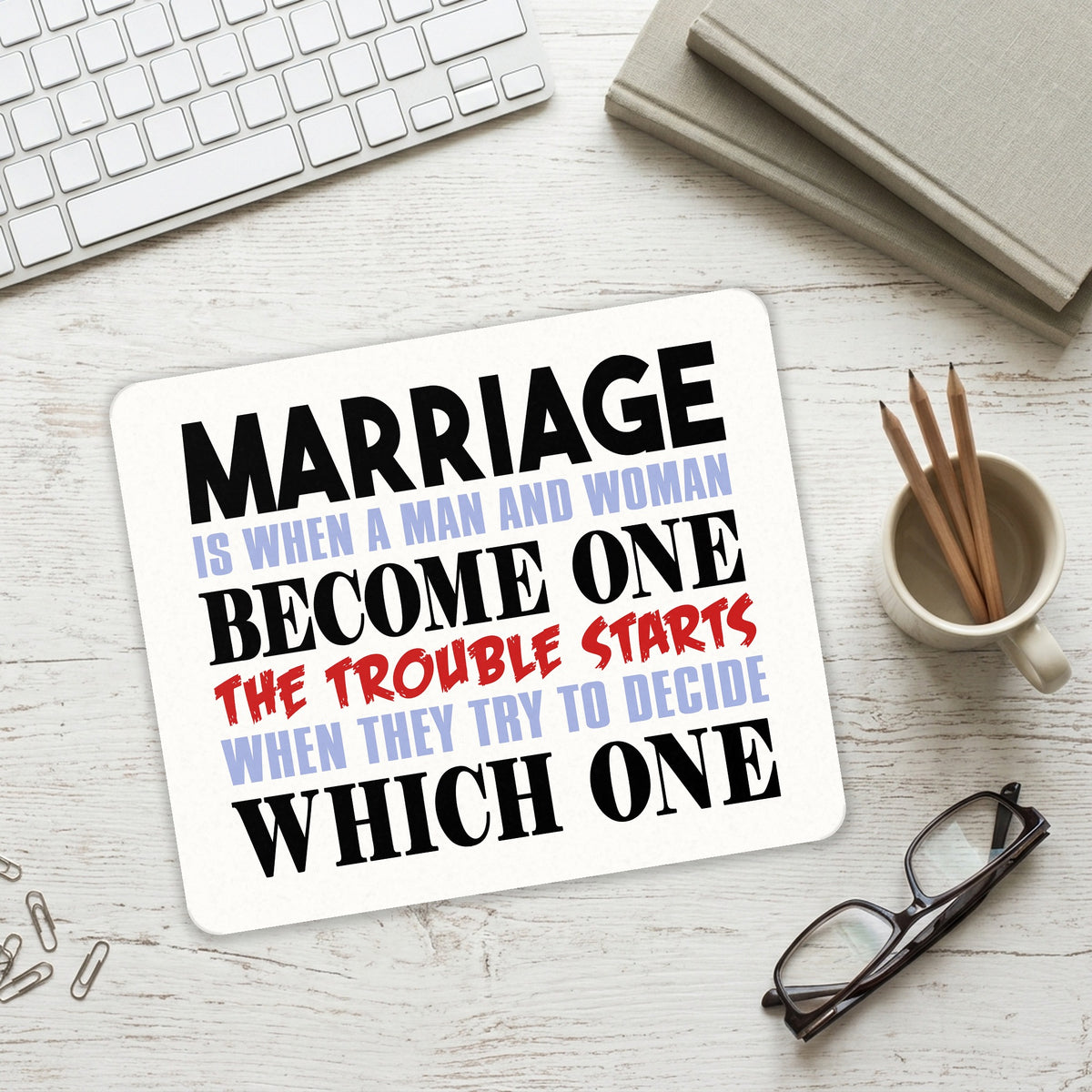 Marriage Trouble Starts mouse pad on a desk with a keyboard