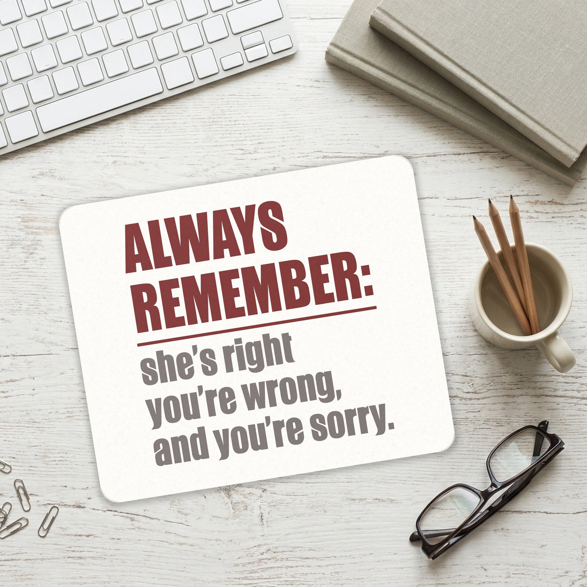 Remember: She's Right You're Wrong mouse pad on a desk with a keyboard