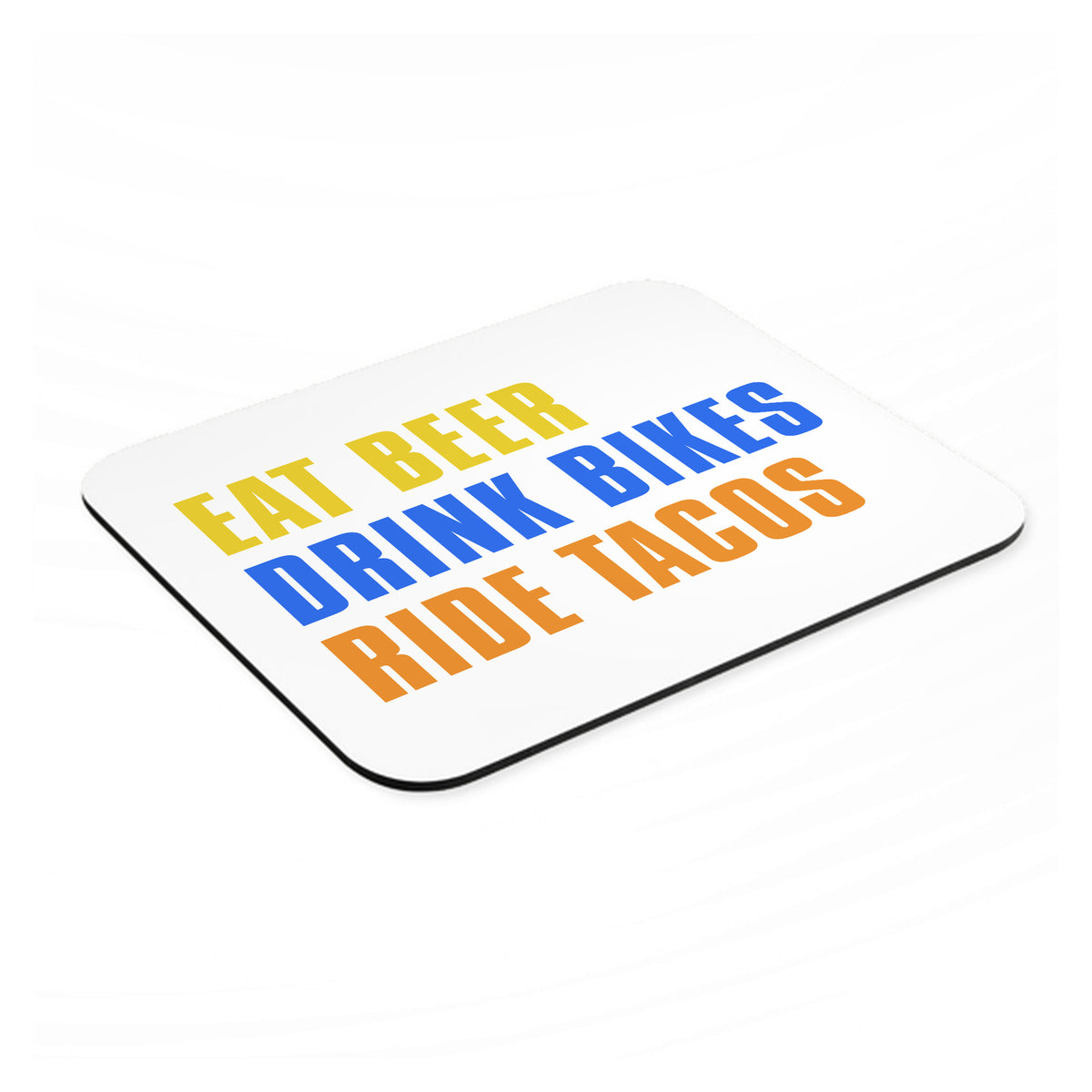 Eat Beer Drink Bikes Ride Tacos mouse pad, angled view showing the 1/4 inch thick base
