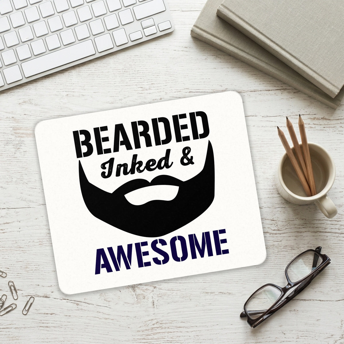 Bearded Inked & Awesome mouse pad on a desk with a keyboard