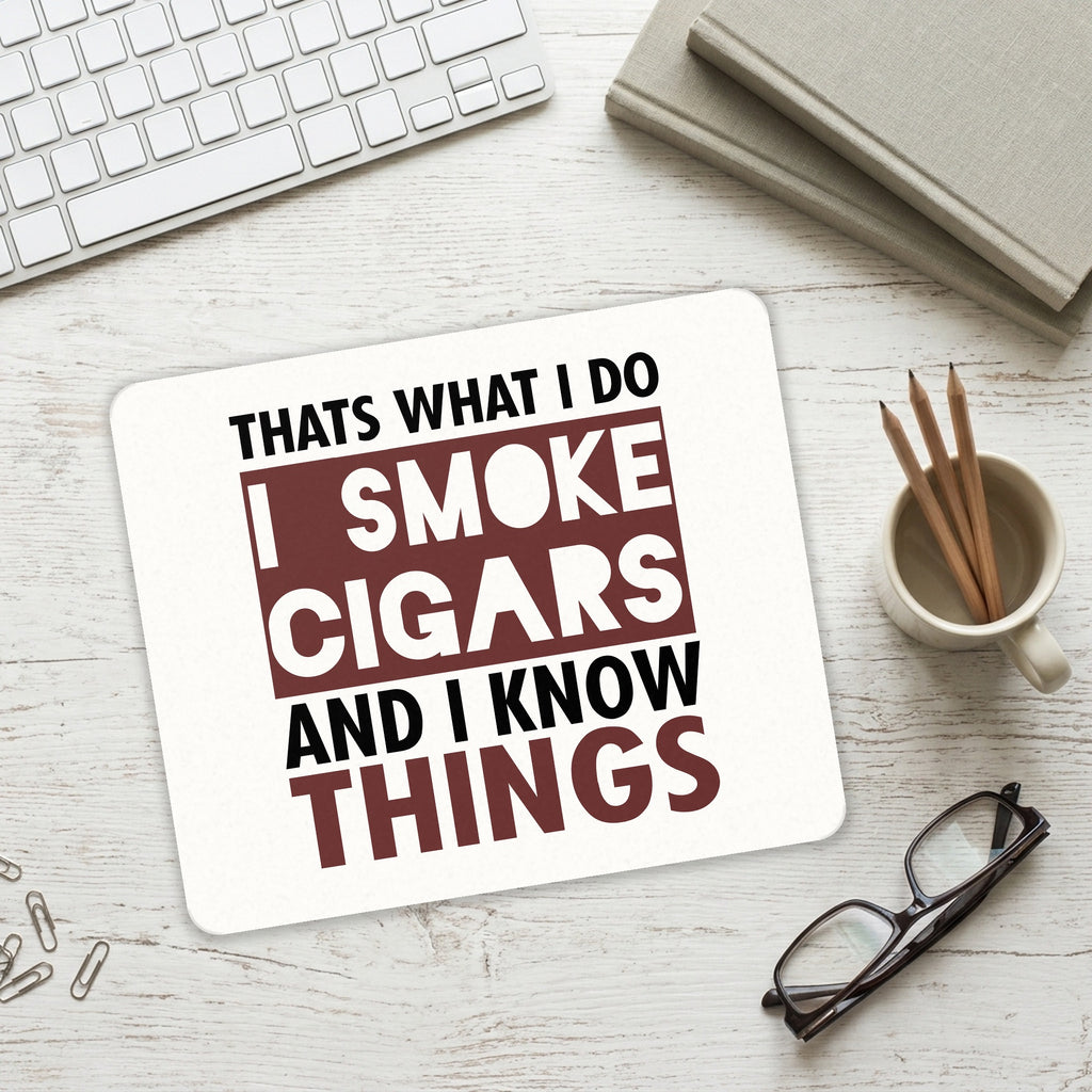 I Smoke Cigars And I Know Things mouse pad on a desk with a keyboard