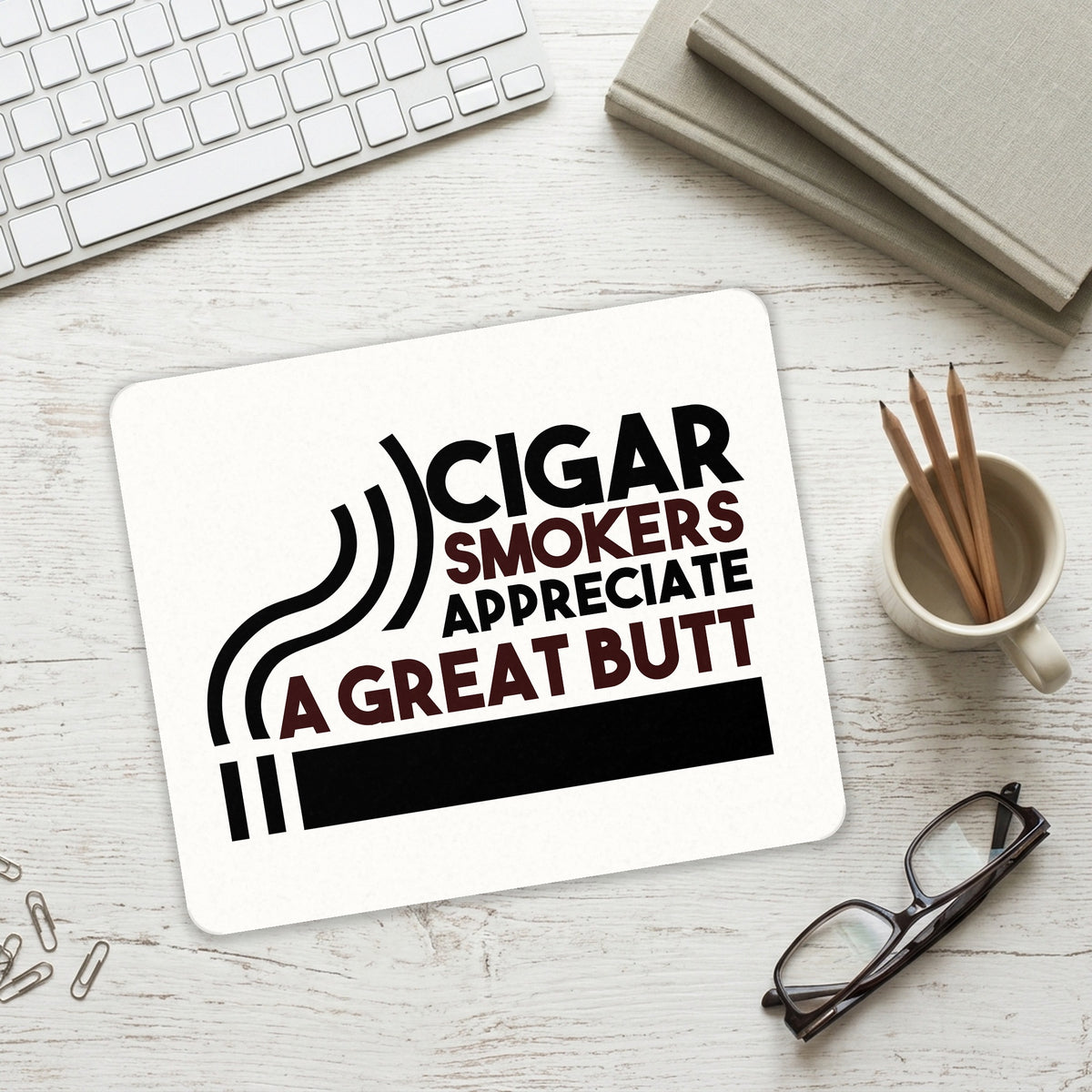 Cigar Smokers Appreciate a Great Butt mouse pad on a desk with a keyboard