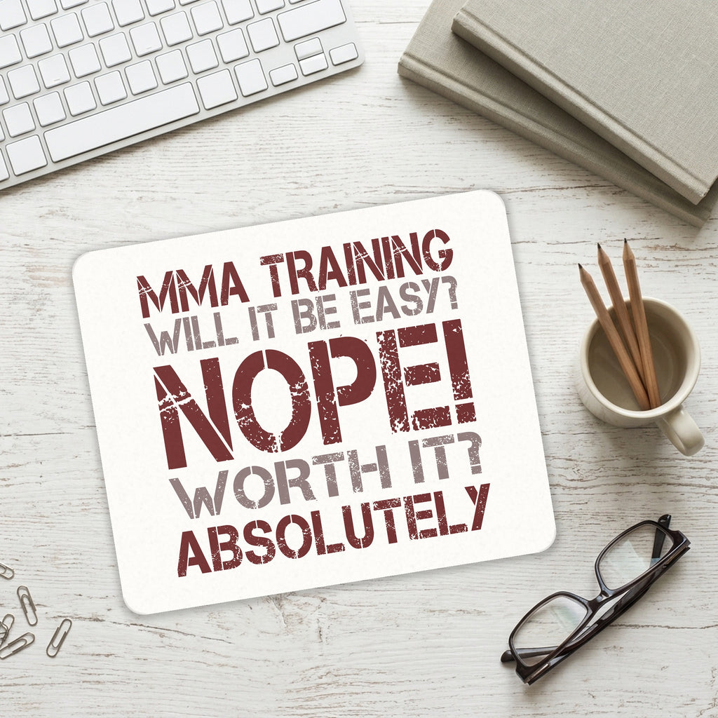 MMA Training Easy? Nope! Worth It! mouse pad on a desk with a keyboard