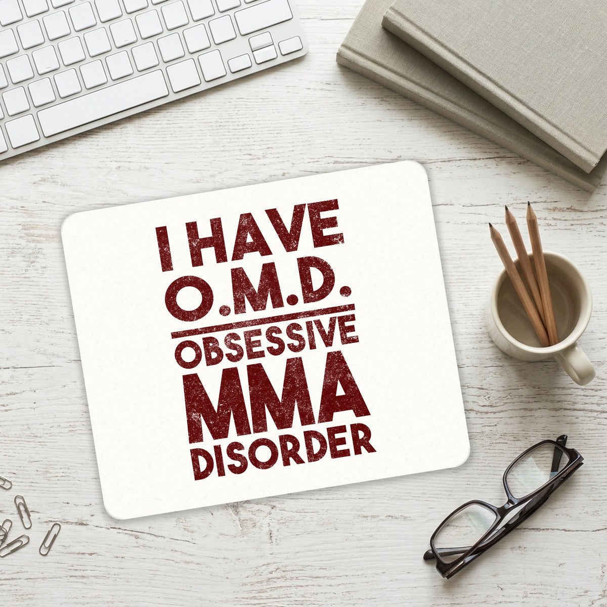 I Have OMD - Obsessive MMA Disorder mouse pad on a desk with a keyboard