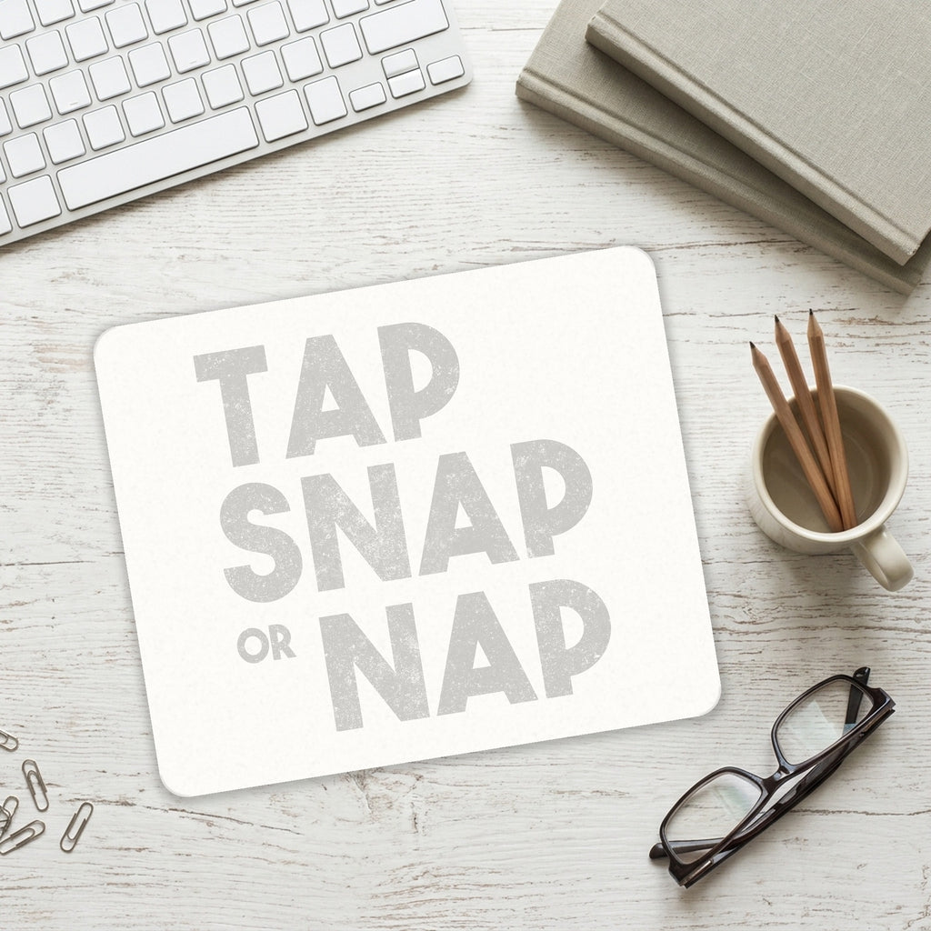 Tap Snap or Nap mouse pad on a desk with a keyboard