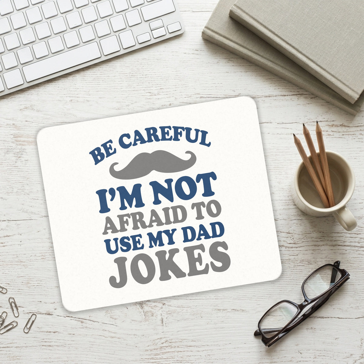 Be Careful Not Afraid to Use Dad Jokes mouse pad on a desk with a keyboard