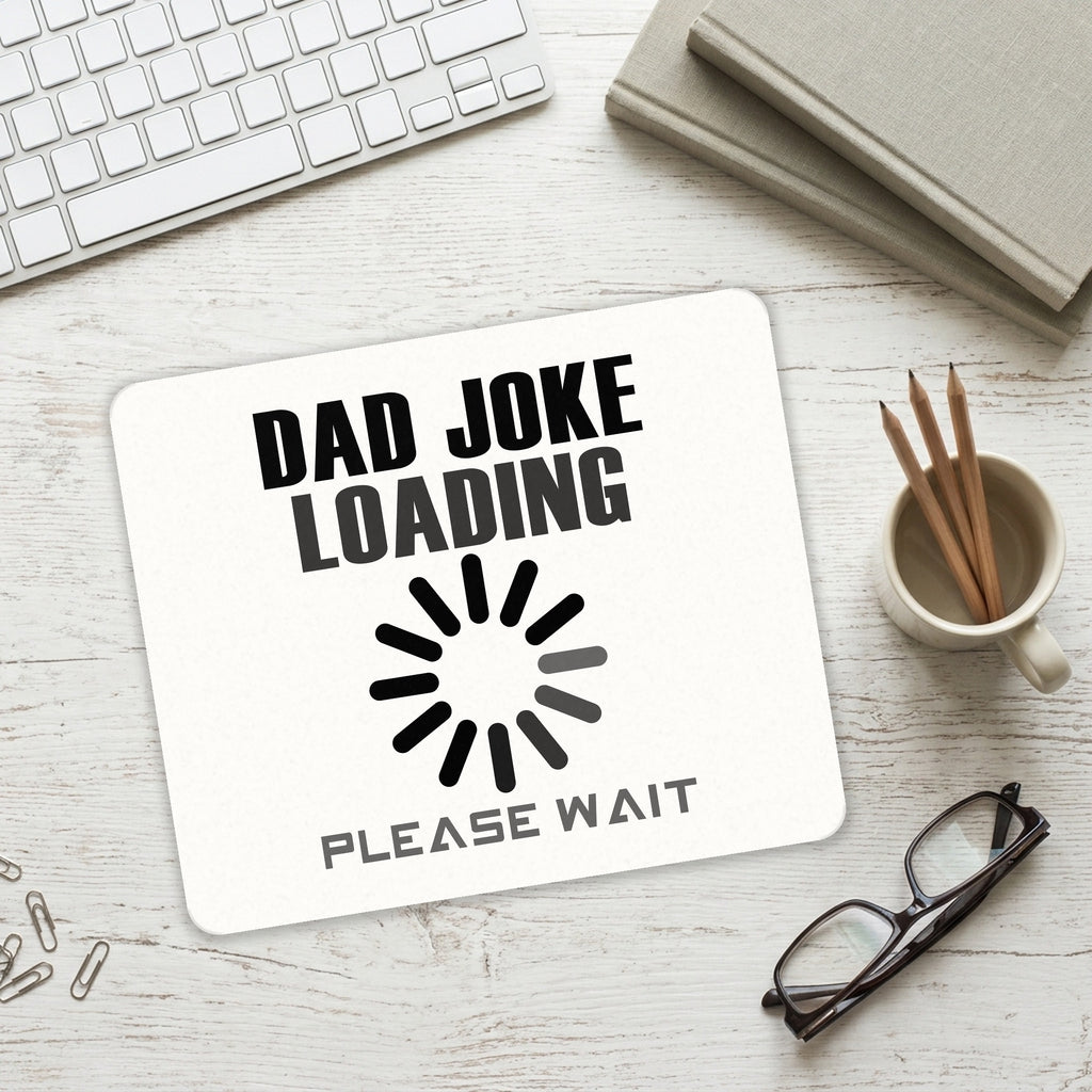Dad Joke Loading Please Wait mouse pad on a desk with a keyboard