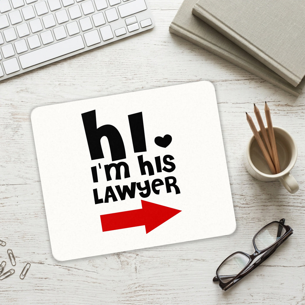 Hi. I'm His Lawyer mouse pad on a desk with a keyboard